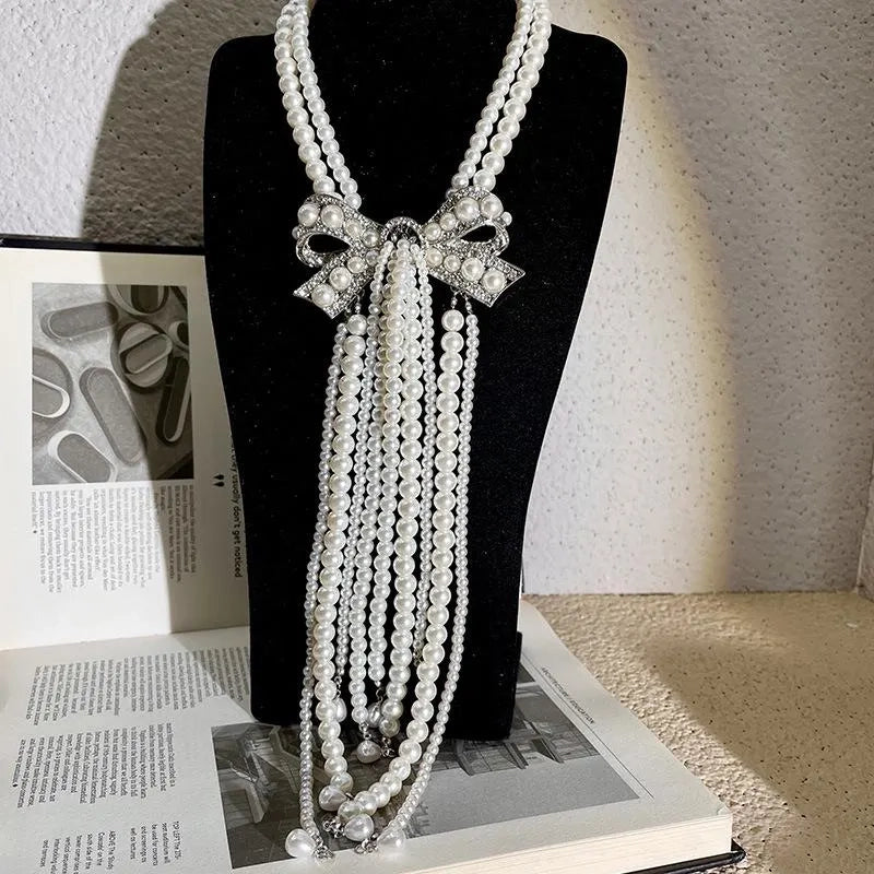 Collana con fiocco doppio strato e nappa di perle, realizzata a mano, regalo di Natale o di compleanno.