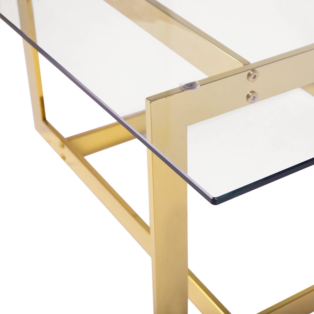 Tavolino da caffè con struttura in metallo dorato e piano quadrato in vetro dal design glam geometrico