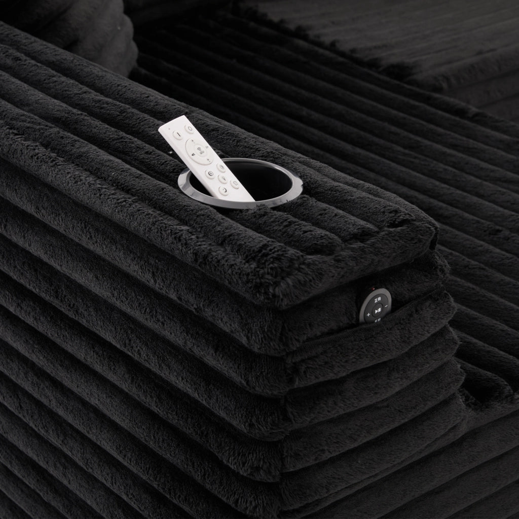Divano modulare a U ULEVR 320x155 cm in velluto a coste nero, portabevande, tasca laterale e 6 cuscini