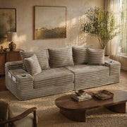 Divano in velluto a coste color khaki, schienale alto, tasche laterali e portabicchieri, modulare e trasformabile in divano letto