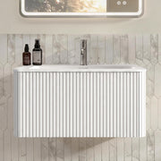 Mobile bagno con lavabo e cassetti push to open in MDF; compensato e Solid Surface bianco