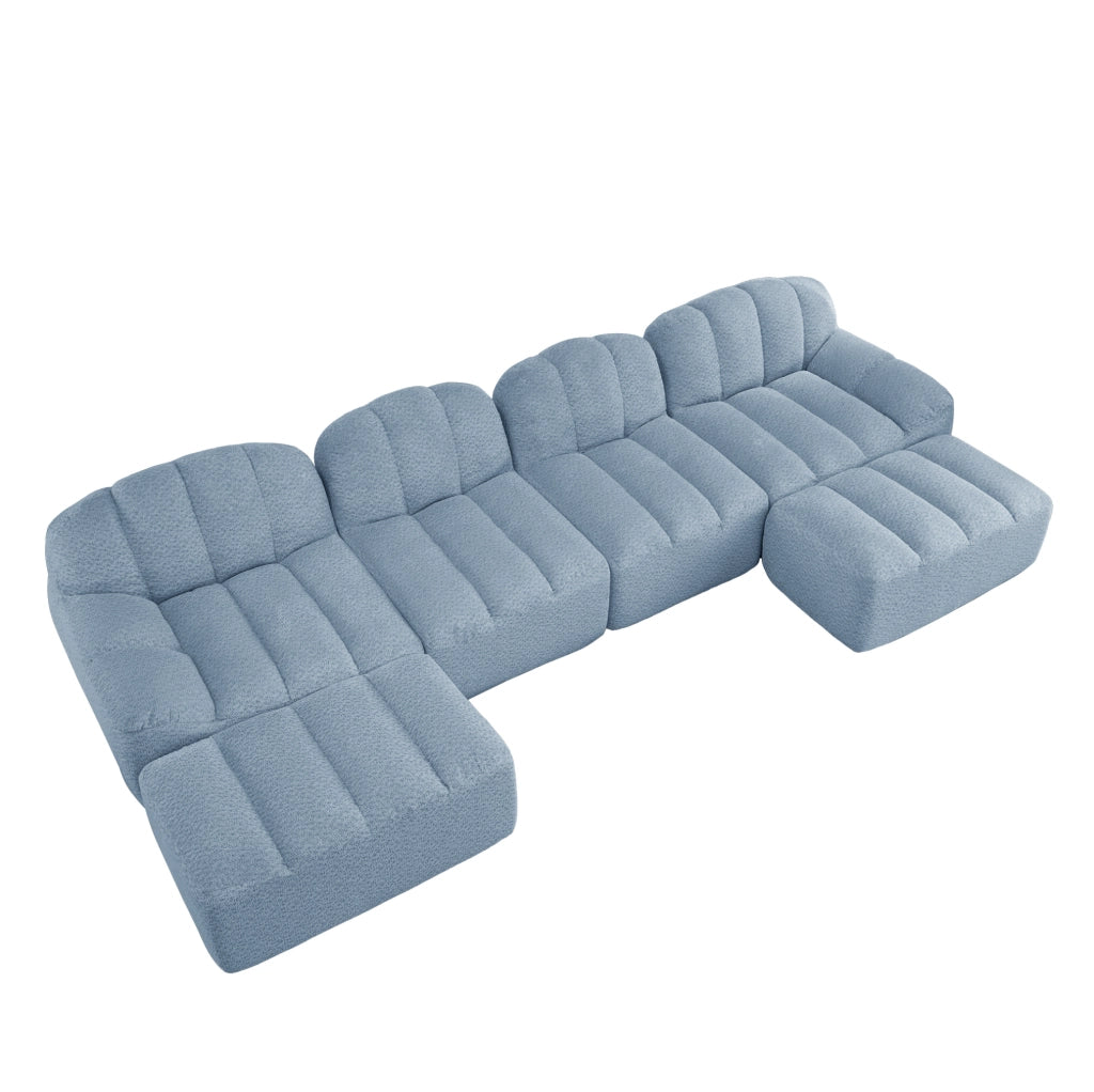 Divano modulare frameless in fleece granulato blu; configurazione U/L/4 posti con schiuma 32D