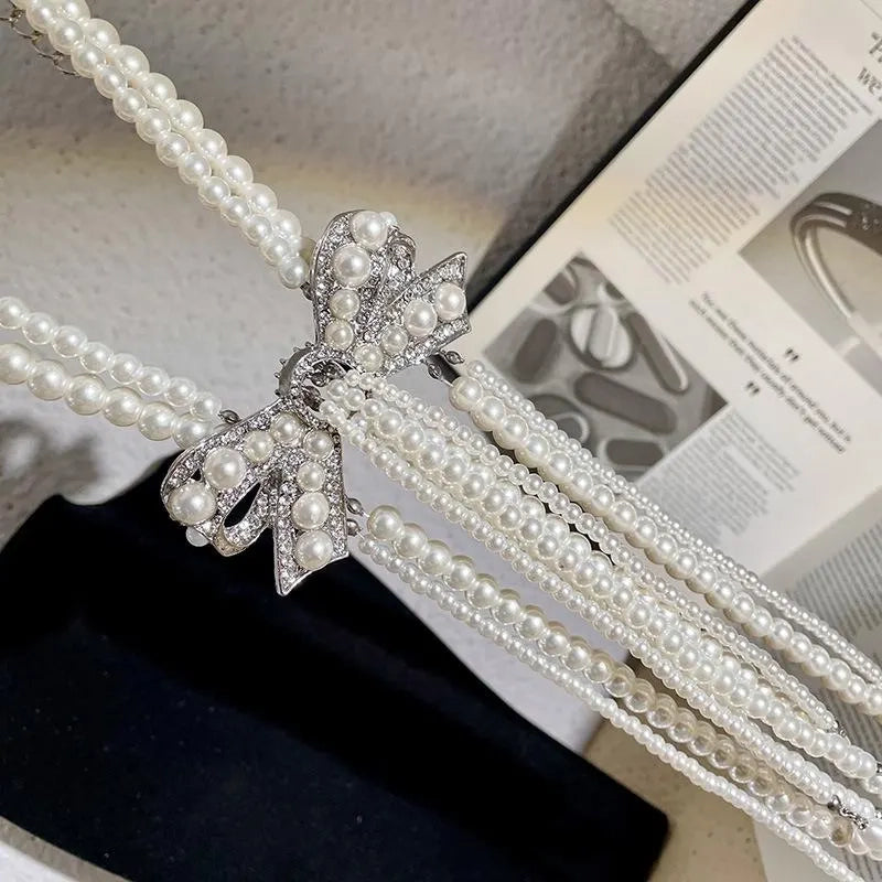 Collana con fiocco doppio strato e nappa di perle, realizzata a mano, regalo di Natale o di compleanno.