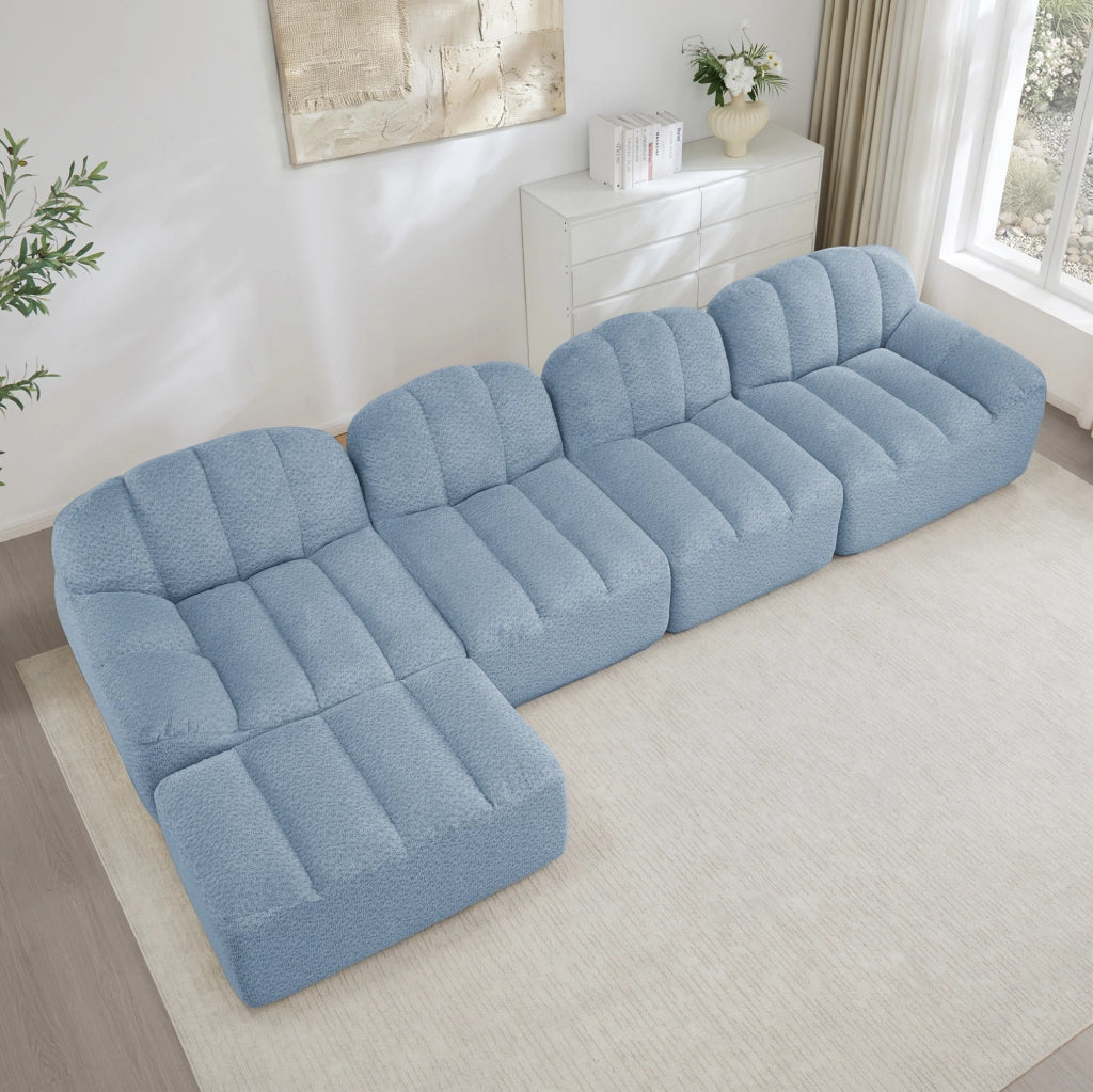 Divano modulare 4 posti con ottomana collegabile; 366x165x79 cm; pile granulato blu