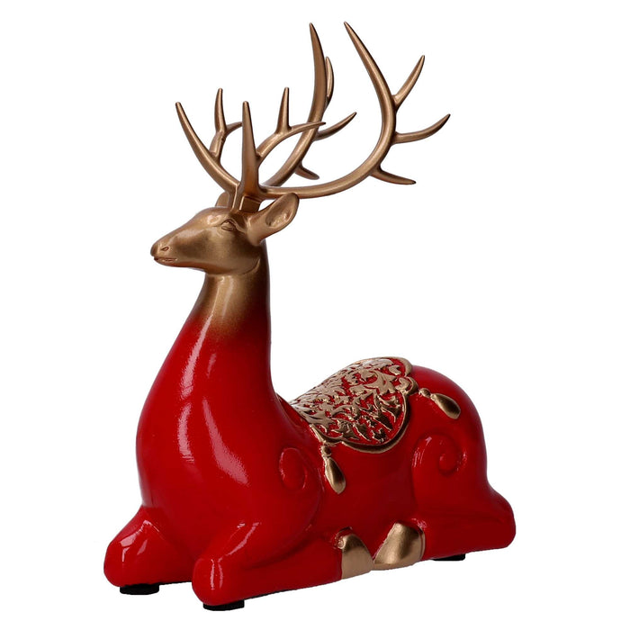 Renna resina seduta oro e rosso cm 17x8xh20