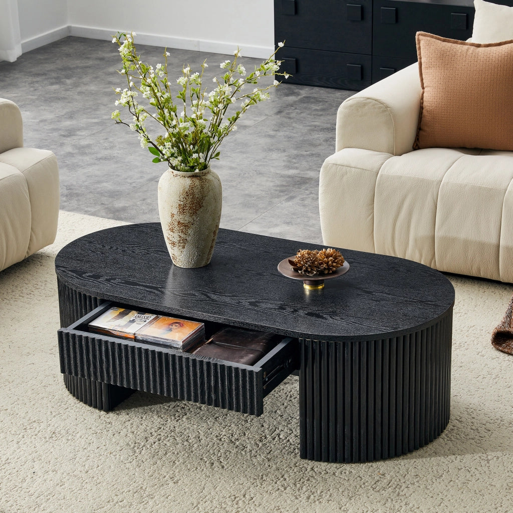 Tavolino basso ovale con cassetto e vano aperto, rivestimento a scanalature, per soggiorno, nero 118 × 65 × 17 cm