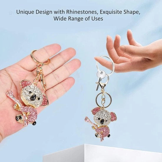 Sleutelhanger con cristalli strass rosso - metallo - unico accessorio per la casa - regalo per donna - disponibile in unico formato - design trendy e carino.