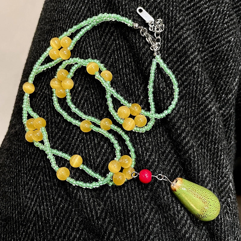 Collana vintage con perline a goccia in ceramica verde
