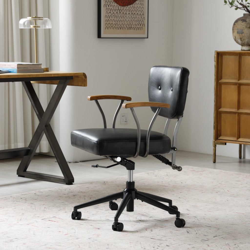 Sedia da ufficio ergonomica girevole con rotelle in pelle premium e struttura in metallo per ufficio domestico nera