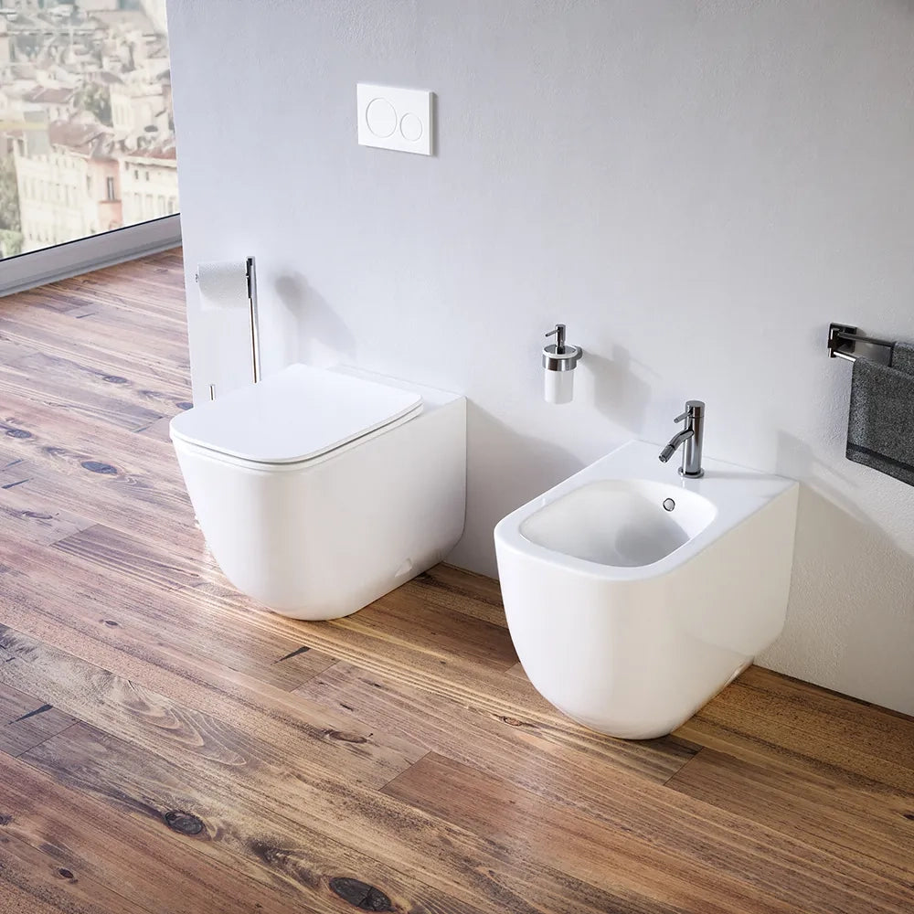 Sanitari filomuro in ceramica bianco lucido vaso tornado silent flush sedile soft-close e bidet | Riga
