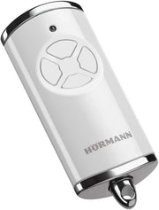 Trasmettitore manuale HSE 4 BS (frequenza 868 MHz, bianco lucido, azionamento per porta del garage con tappi cromati, batterie, dimensioni 28 x 70 x 14 mm, anello portachiavi) 4511565
