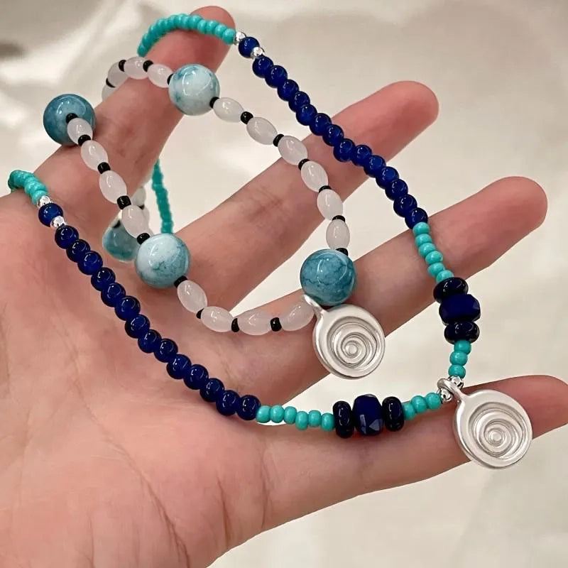Collana con ciondolo a forma di conchiglia in pietra naturale: gioielli boho con perline