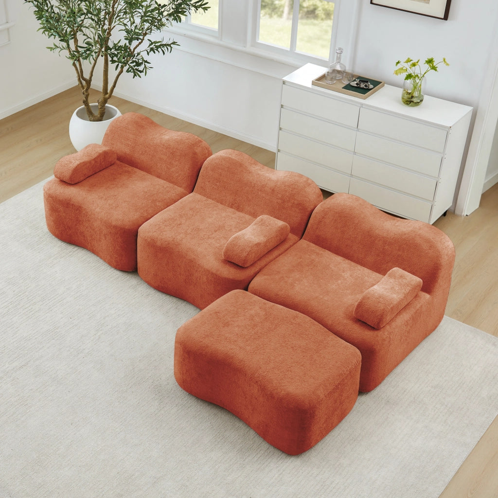Divano angolare modulare senza struttura con pouf collegabile e seduta profonda in velluto arancione