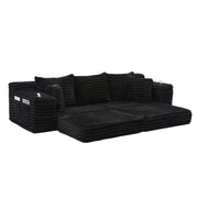 Divano letto modulare con schienale alto; tasche laterali e portabicchieri in corduroy nero