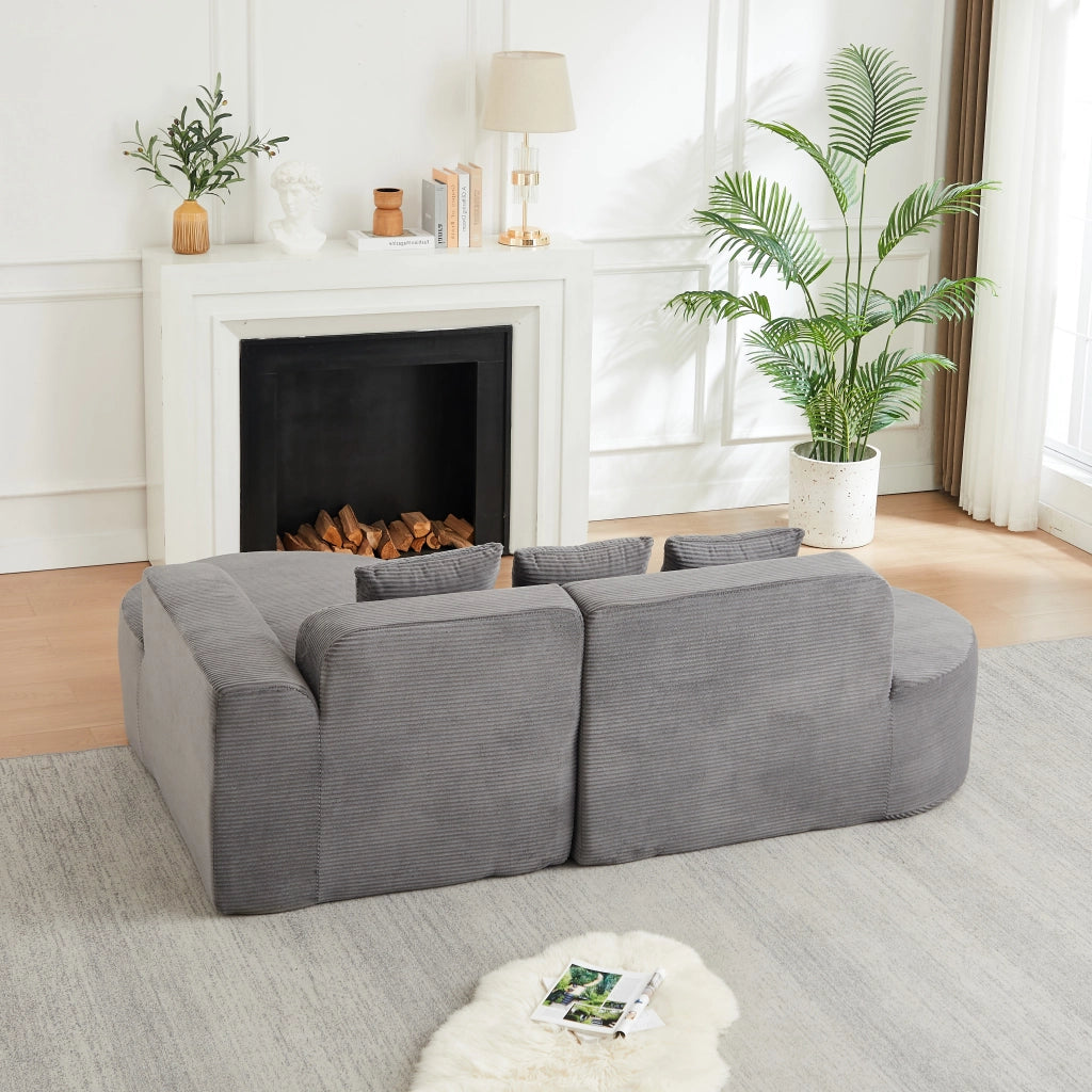 Divano modulare a L con linee curve 220x155 cm in velluto a coste grigio