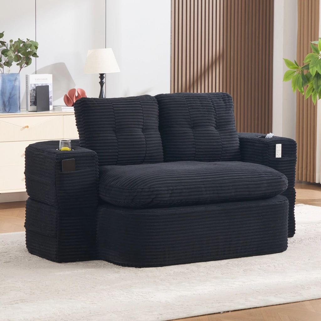 Poltrona letto 2 in 1 in corduroy nero, seduta extra profonda con schienale alto, doppi portabevande e tasche laterali