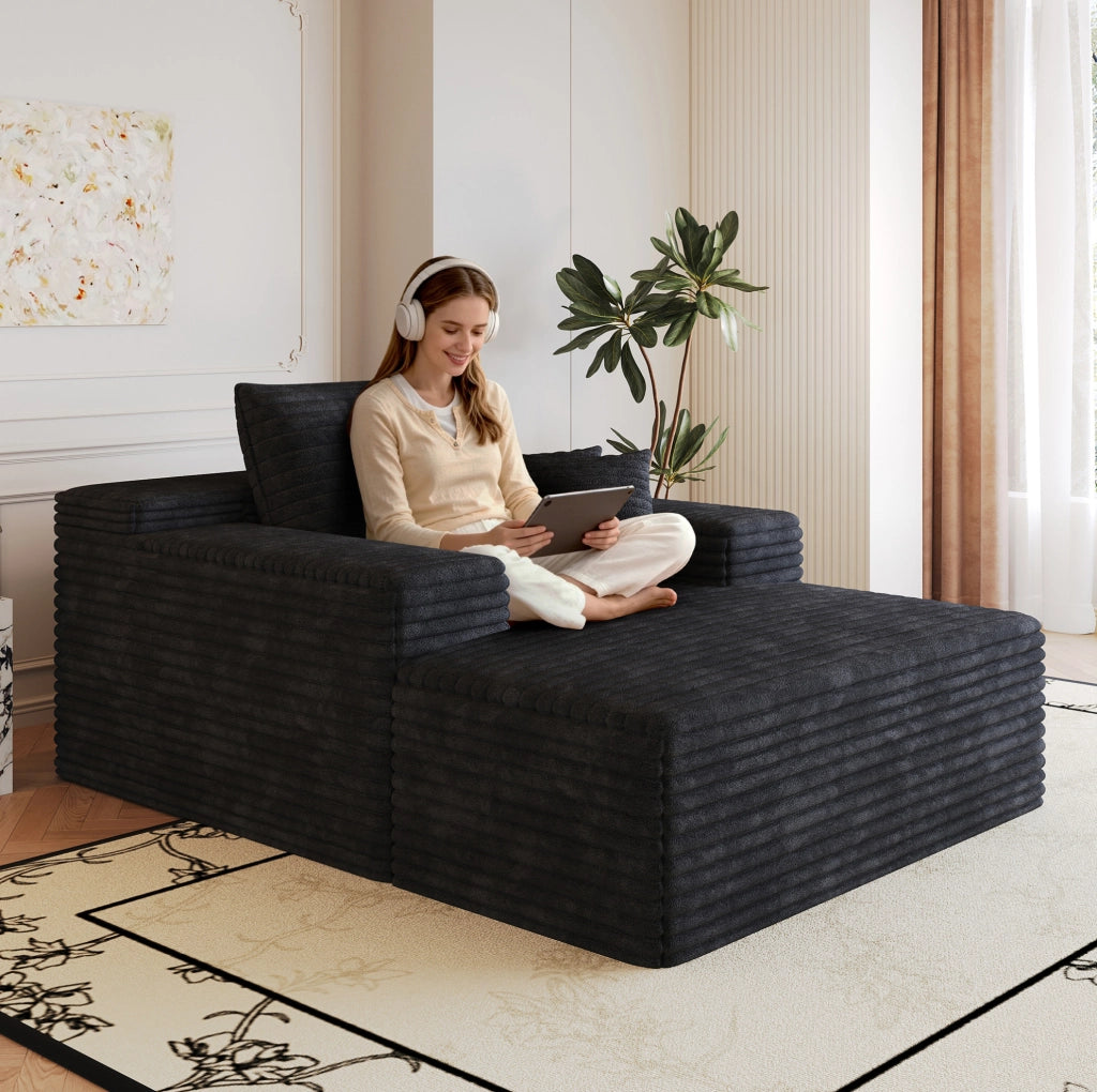 Divano in velluto a coste nero, modulare e confortevole