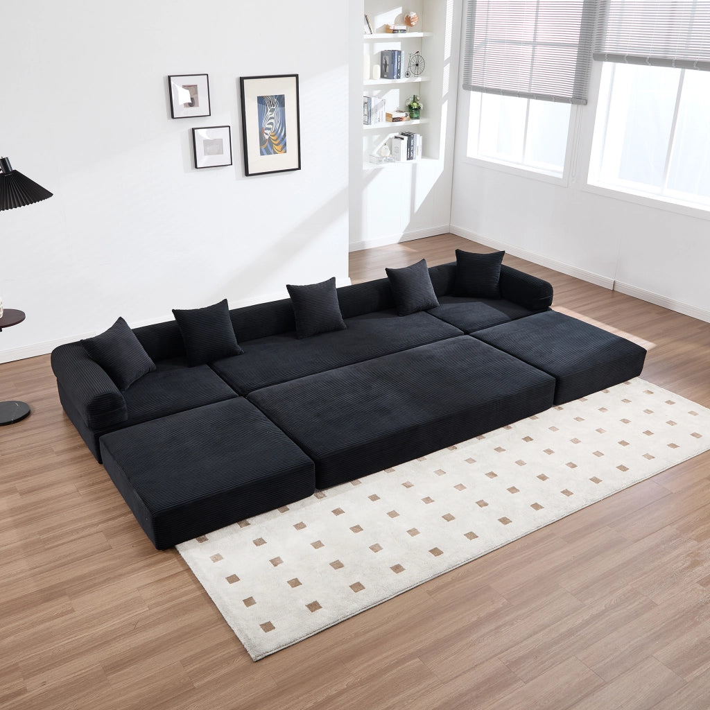 Divano modulare 270x180x64 cm trasformabile in letto con tasca laterale in velluto a coste nero