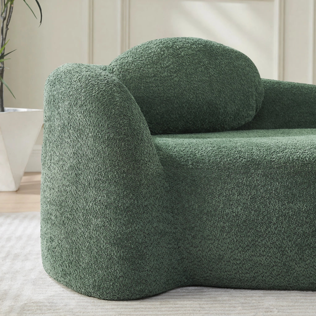 Divano dal design arrotondato in tessuto teddy verde