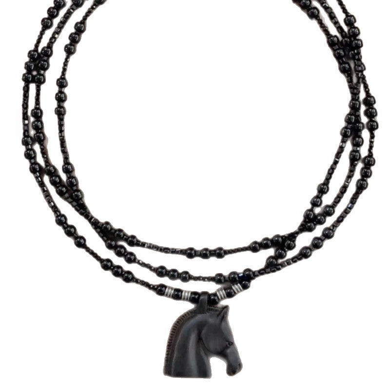 Collana lunga con ciondolo a testa di cavallo in ebano