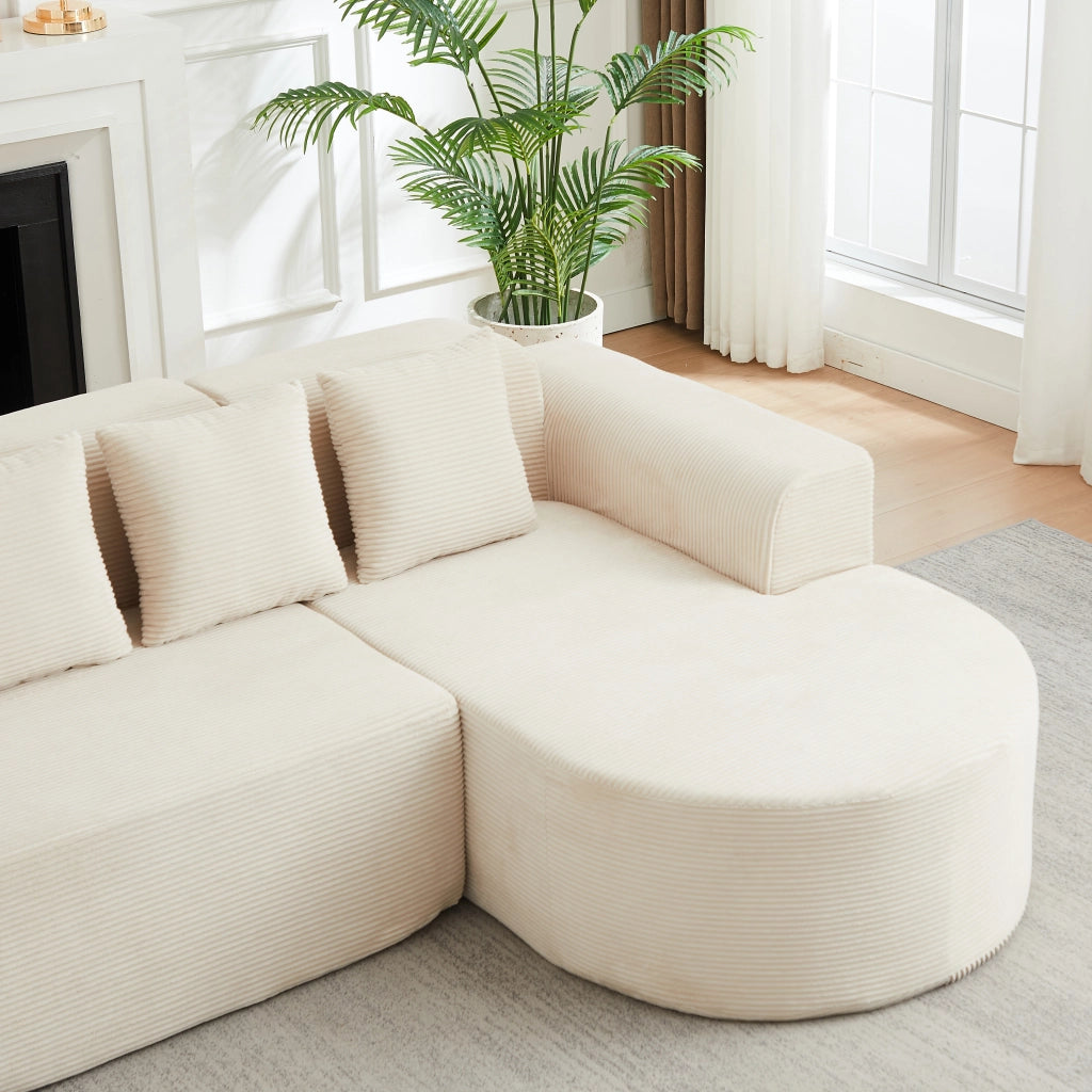 Divano angolare a L con chaise longue curva tre cuscini senza montaggio in velluto a coste beige 220 × 155 × 70 cm