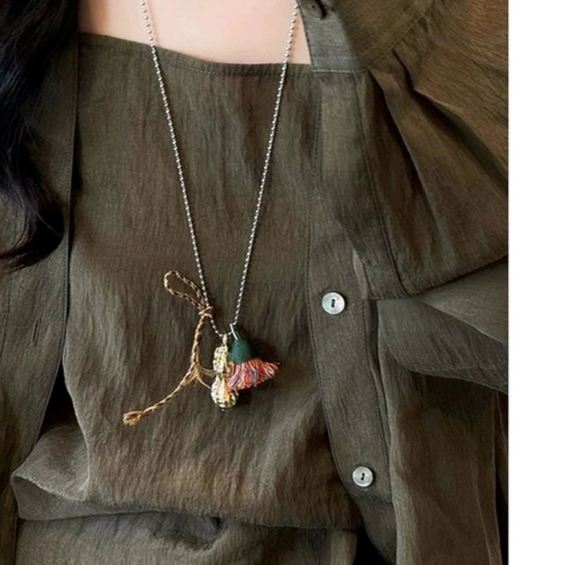 Catena per maglione con nappine a forma di arachide, dal design unico e di nicchia, in stile boh¨¦mien.