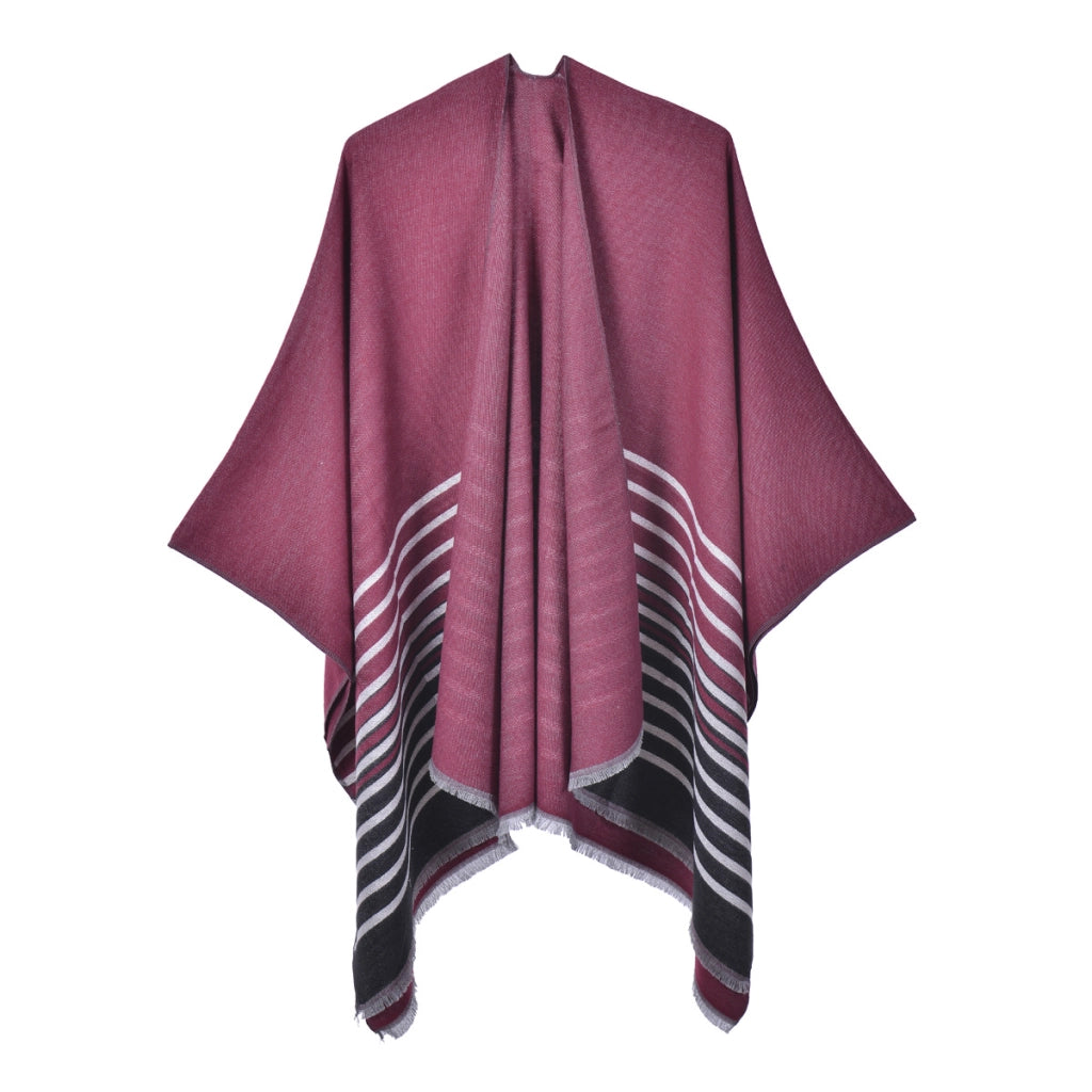 Mantella calda da donna reversibile in maglia con spacco e nappine.