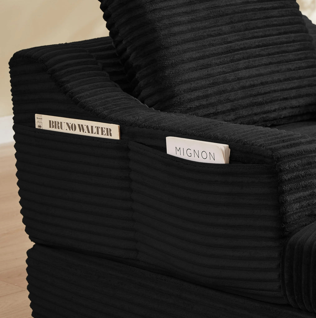Poltrona lounge in velluto a coste nero con design a doppio strato