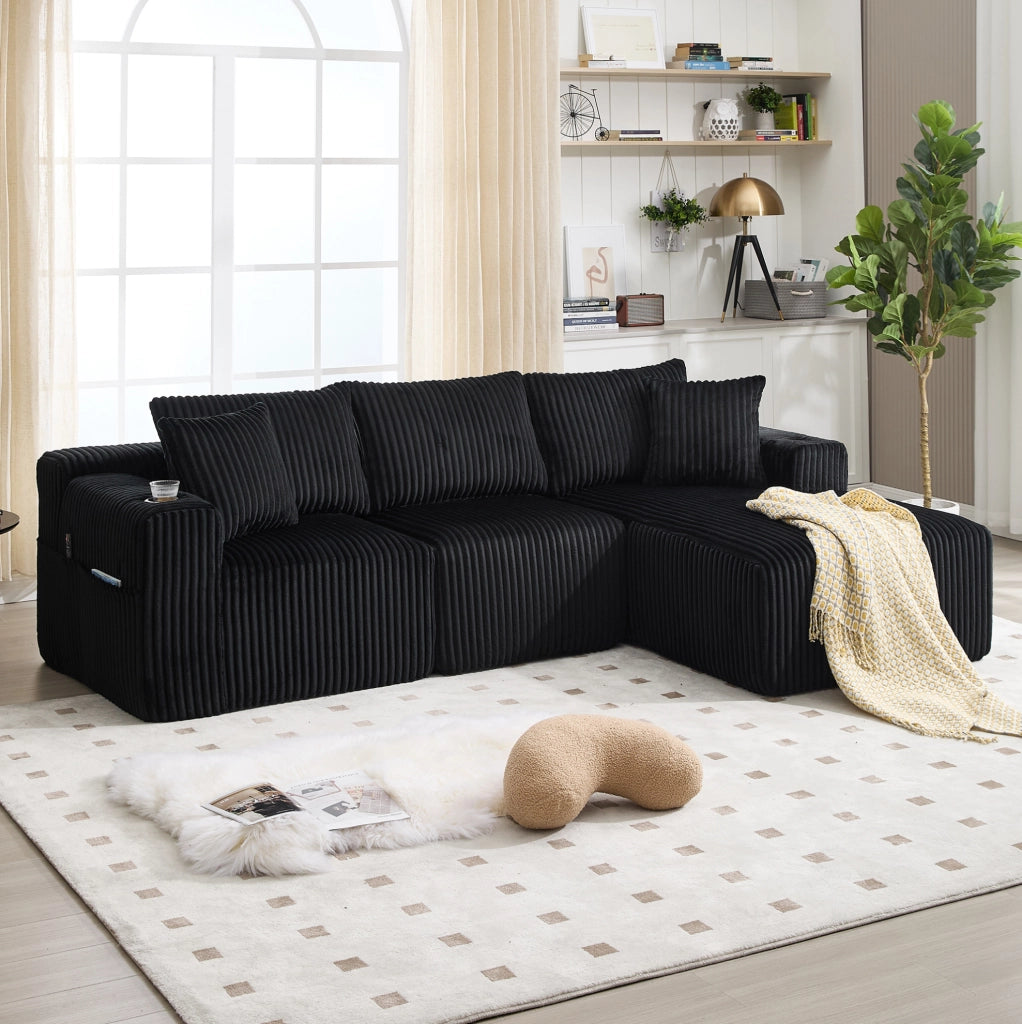 Divano modulare 257x160x62 cm con 5 cuscini; tasche laterali e portabicchieri in velluto a coste nero