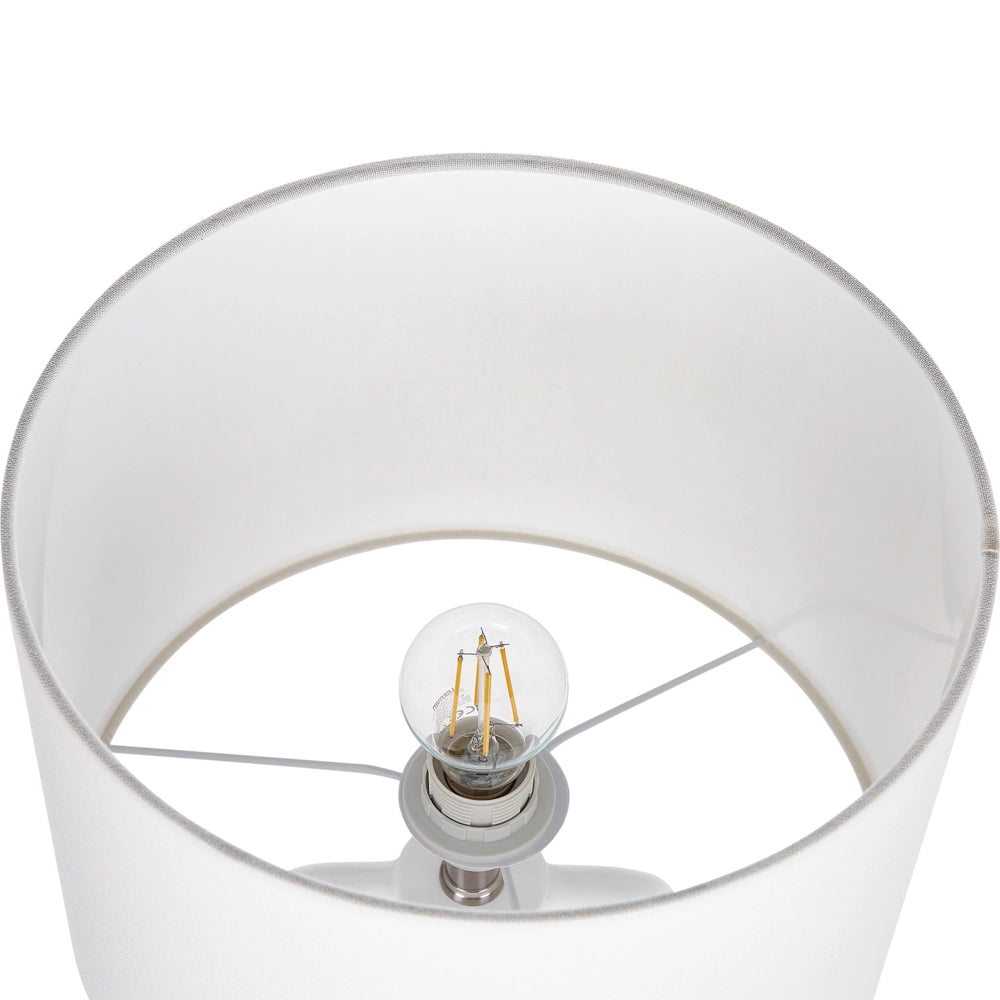Lampada da tavolo in ceramica bianca con paralume a tamburo in lino base minimalista stile design contemporaneo