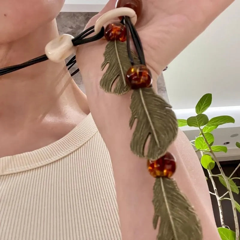 Collana vintage con ciondolo a foglia e perline: gioielli con nappe fatti a mano