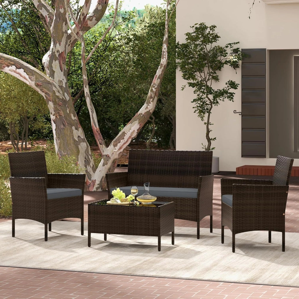 Set di Salotto da Giardino in Rattan 4 Pezzi, Set Mobili da Esterno in Vimini con Cuscini Morbidi, Divanetto e Poltrona con Tavolo in Vetro Temperato per Giardino e Veranda (Grigio)