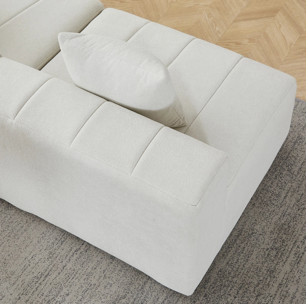 Divano modulare curvo in ciniglia beige con 2 cuscini