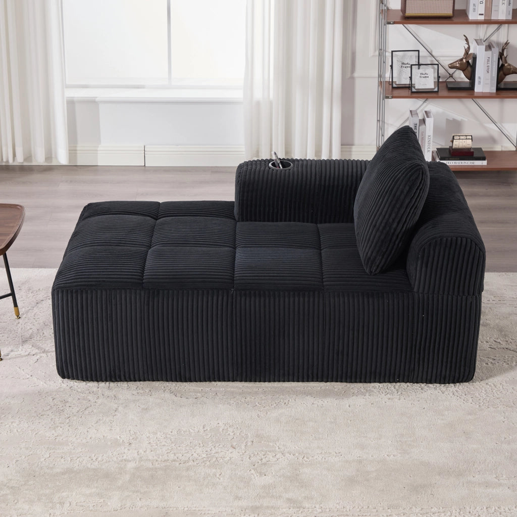 Divano compatto in velluto a coste nero con tasche laterali e portabicchieri; 158x93x61 cm