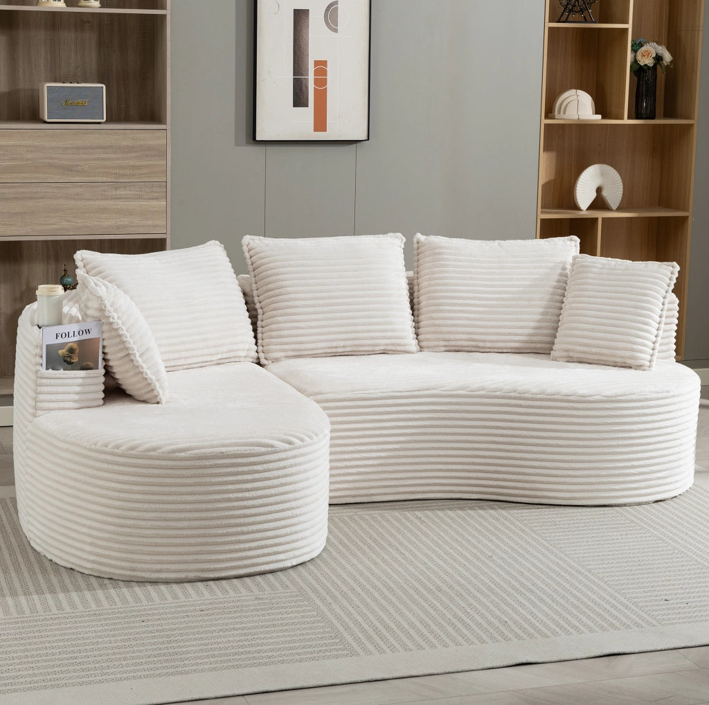 Divano curvo beige in velluto a coste con portabevande e tasche laterali per il massimo comfort
