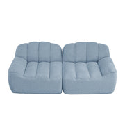 Divano modulare 2 posti senza struttura; forma a conchiglia; seduta ampia; in fleece granulare blu