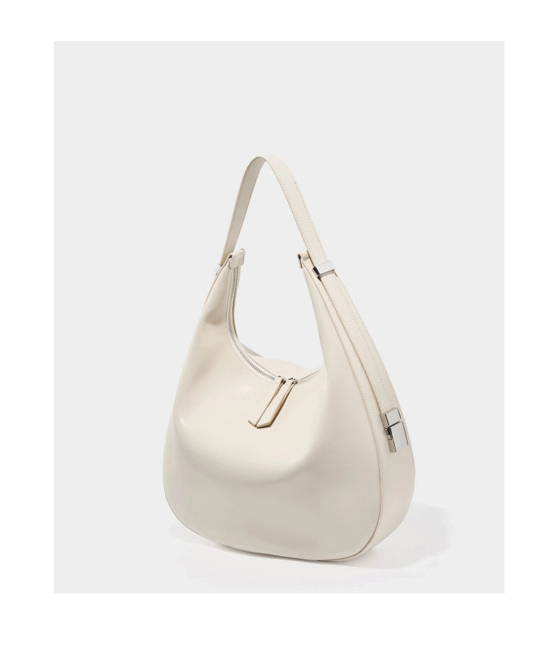 Borsa a tracolla da donna in vera pelle con tracolla larga, colore bianco.