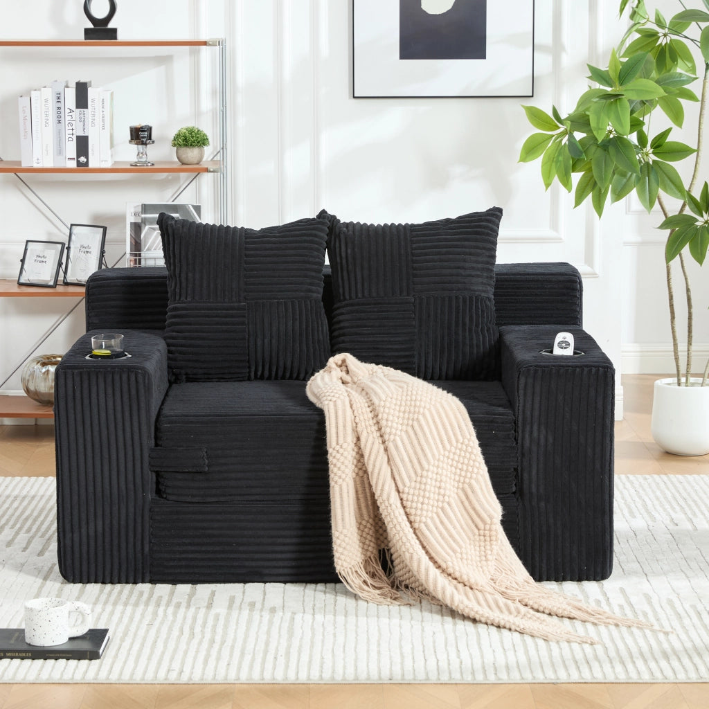 Pouf divano in velluto a coste nero 151x133x64 cm con tasche laterali e 2 cuscini