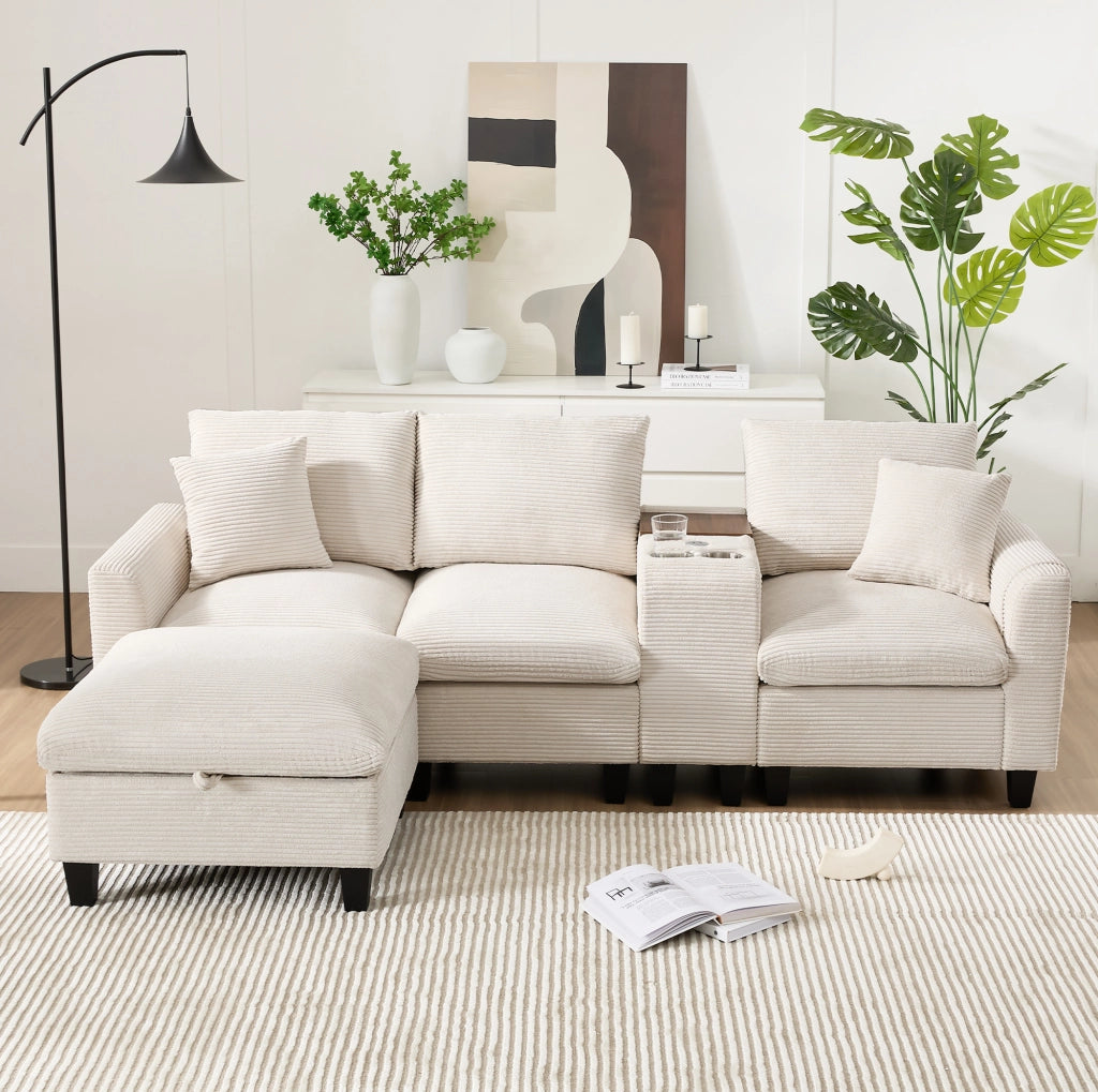 Divano angolare modulare 4 posti con console; 2 portabicchieri; 2 porte USB; pouf e cuscini in velluto a coste beige