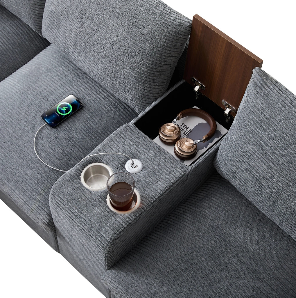 Divano angolare L 229x149.5x83 cm con console centrale; porta bicchieri e USB in velluto a coste grigio