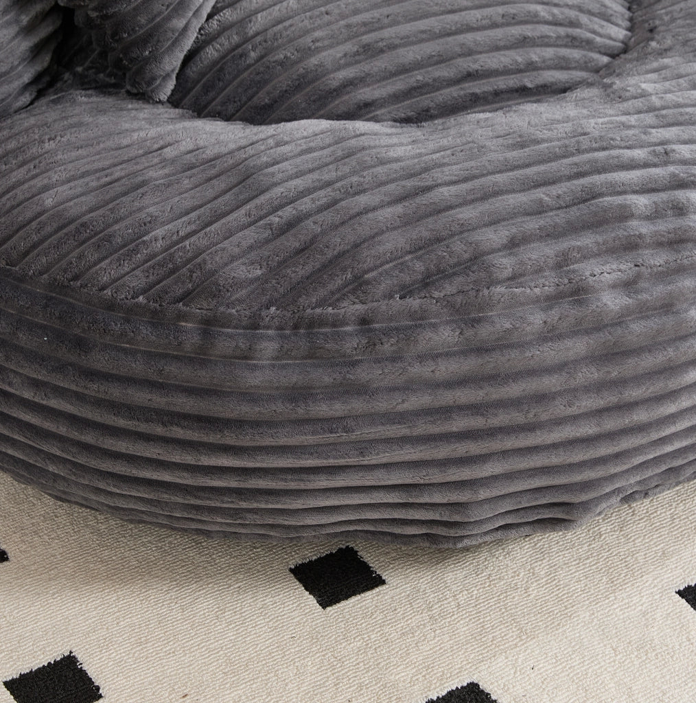 Poltrona sacco in velluto a coste con schienale alto e braccioli; 108 x 108 x 52 cm; grigio scuro