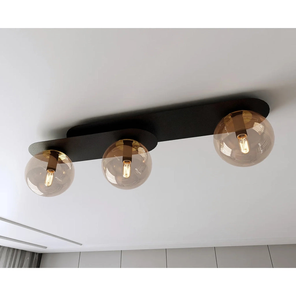 Plafoniera Minimal 3 Luci Teia In Acciaio Nero E Sfere Vetro Ambra