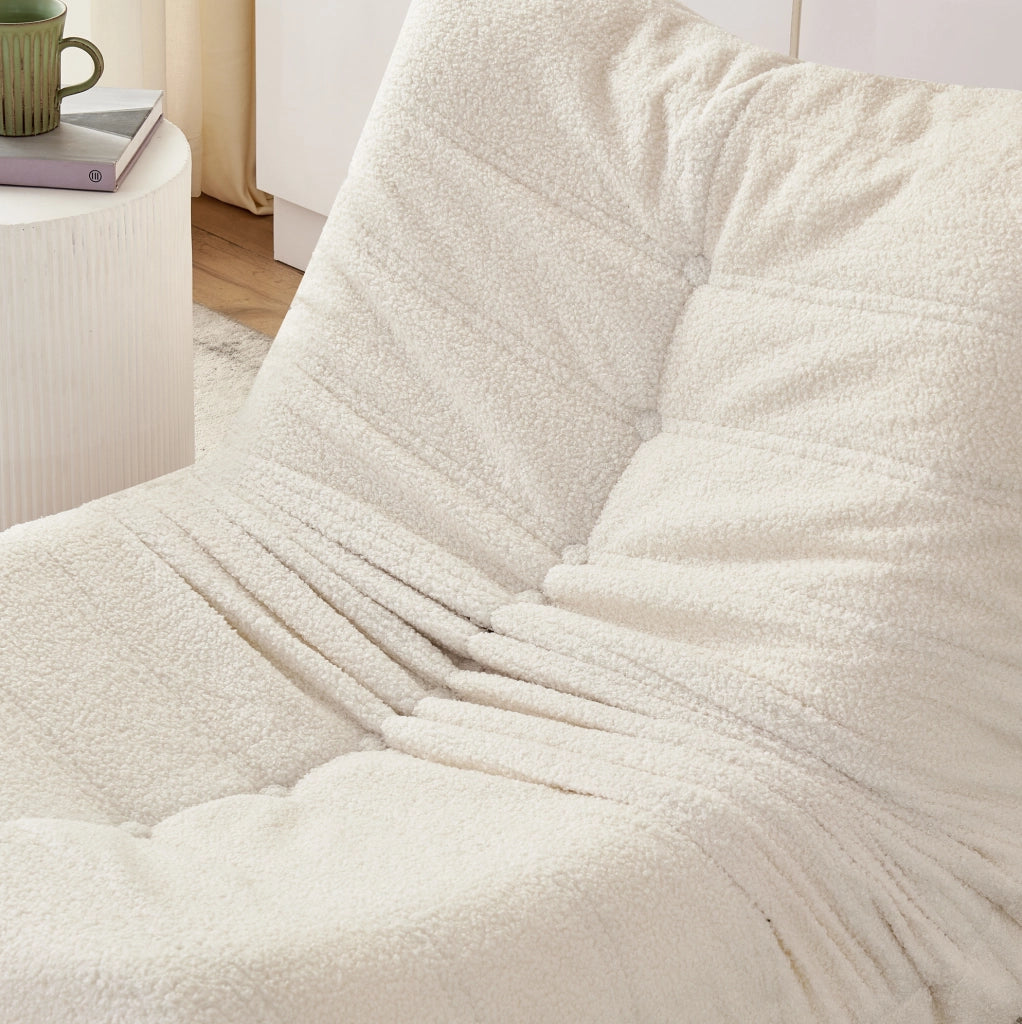 Poltrona da pavimento in teddy beige con poggiapiedi