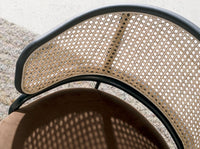 Sedia girevole in rattan e velluto marrone