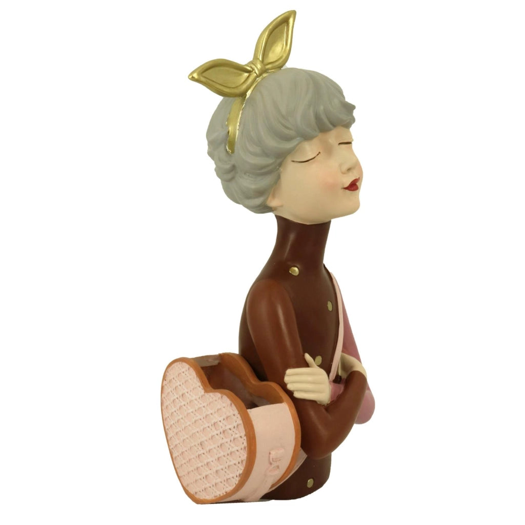 Donna resina con borsa portafiori marrone cm17x13h35