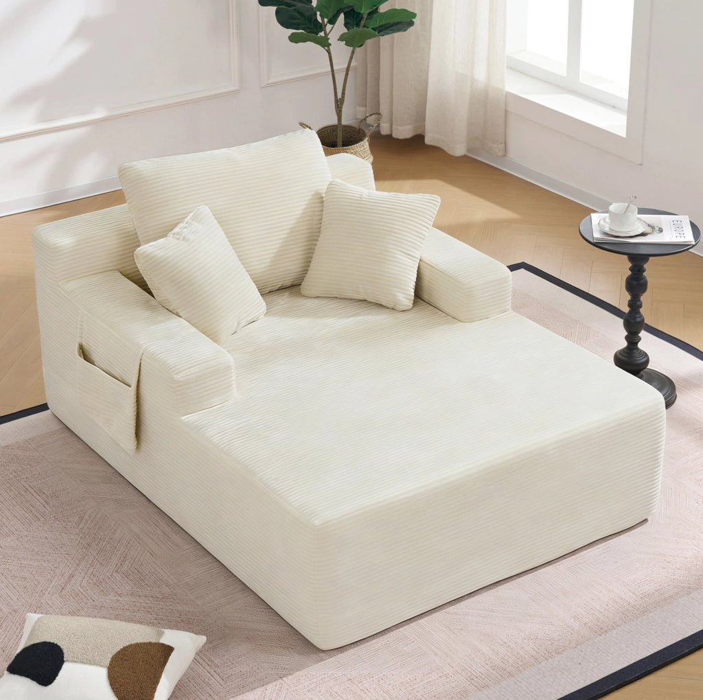 Divano in velluto a coste con tasche laterali; molle integrate e cuscini; beige