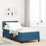 letto a box spring con materasso blu scuro in velluto