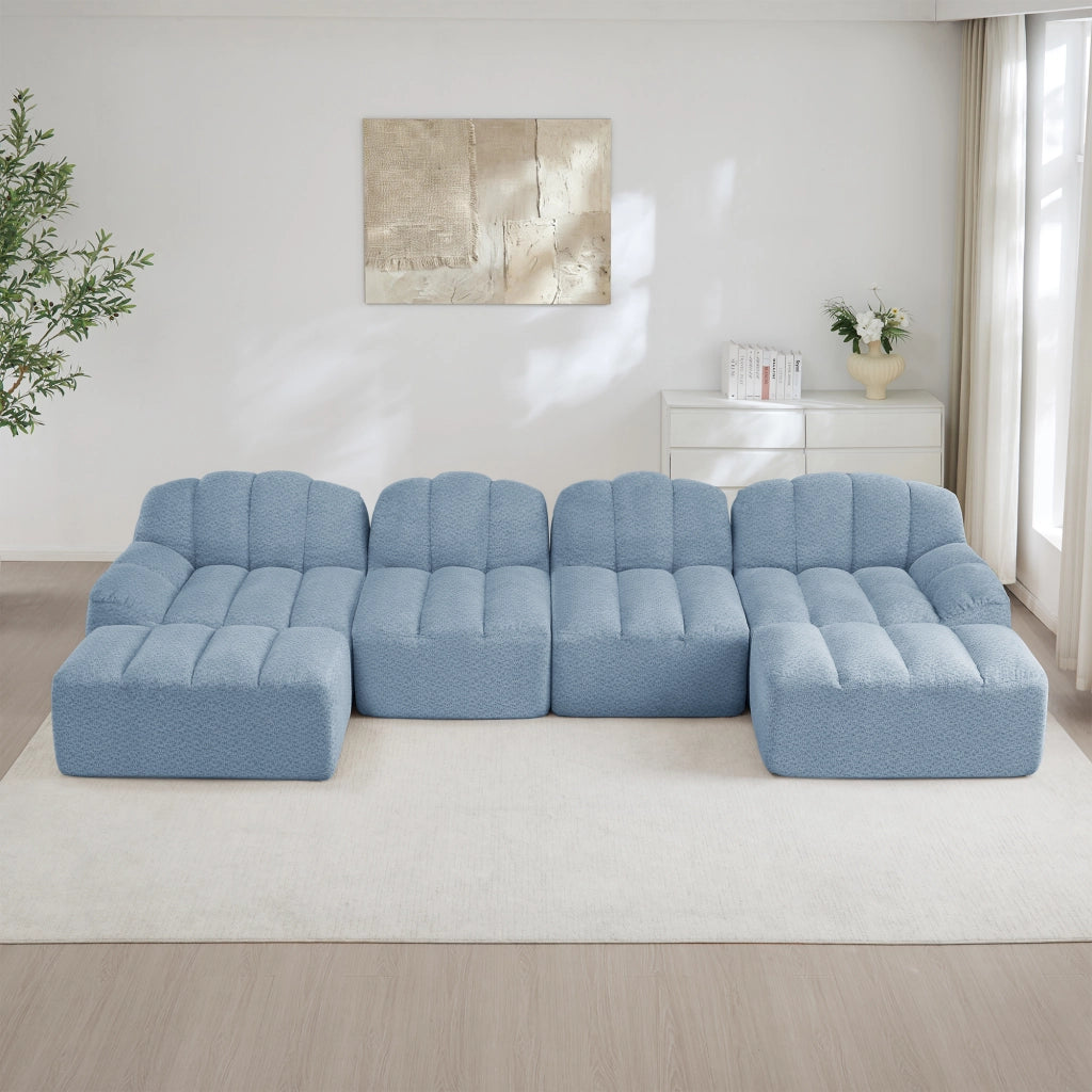 Divano angolare modulare a 4 posti con 2 pouf, seduta profonda e schienale ergonomico in tessuto blu per soggiorno