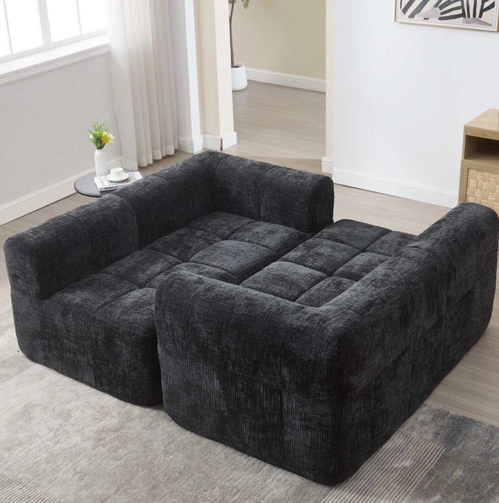 Divano a 2 posti nero con chaise longue, cuscino incluso e tasche laterali per telecomando e smartphone