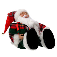 Babbo natale in tessuto rosso seduto con regali, musica e movimento cm xh35,5